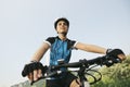 Young woman training on mountain bike and cycling in park Royalty Free Stock Photo