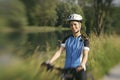 Young woman training on mountain bike and cycling in park Royalty Free Stock Photo