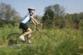 Young woman training on mountain bike and cycling in park Royalty Free Stock Photo