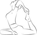 Young woman training in yoga asana - pigeon pose