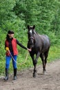 Young woman with Trakehner horse