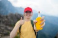 Young woman travel spraying insect repellents on skin with spray bottle during hike in nature top mountain. Skin Royalty Free Stock Photo