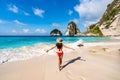 Young woman traveler enjoying the beautiful tropical white sand beach at diamond beach in Nusa Penida island, Bali Royalty Free Stock Photo