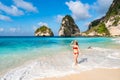 Young woman traveler enjoying the beautiful tropical white sand beach at diamond beach in Nusa Penida island, Bali Royalty Free Stock Photo