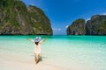 Young woman traveler relaxing and enjoying at beautiful tropical white sand beach at Maya bay Royalty Free Stock Photo