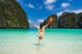 Young woman traveler relaxing and enjoying at beautiful tropical white sand beach at Maya bay in Krabi, Thailand Royalty Free Stock Photo