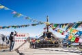 Young woman traveler traveling at Shika Snow Mountain or Blue Moon Valley in Zhongdian city Shangri-La. Yunnan, China. Chinese Royalty Free Stock Photo