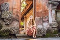 Young woman traveler in Ubud palace, Bali - Inside the Ubud palace, Bali, Indonesia Royalty Free Stock Photo