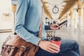 Young woman traveler waiting for a bus on a bus station, travel and active lifestyle concept Royalty Free Stock Photo