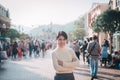 Young woman traveling in Hong Kong Disneyland during winter and Christmas holiday. Hong Kong, China, 17 December 2018