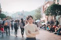 Young woman traveling in Hong Kong Disneyland during winter and Christmas holiday. Hong Kong, China, 17 December 2018