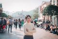 Young woman traveling in Hong Kong Disneyland during winter and Christmas holiday. Hong Kong, China, 17 December 2018