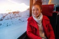 Young woman traveling looking view while sitting in the train