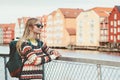 Young woman traveling in Trondheim city Norway vacations weekend Lifestyle fashion outdoor scandinavian houses landmarks architect