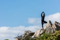 young woman in tree pose practicing yoga outdoors Royalty Free Stock Photo