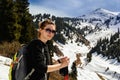 Young woman with trekking sticks in mountainsYoung woman with trekking sticks Royalty Free Stock Photo