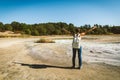 Young woman trekking to the Solfatara di Manziana sulphurous area in Italy.