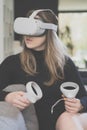 Young woman tries out VR headset for first time