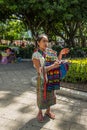 Young woman tries to sell jewelry, Antigua, Guatemala