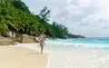 Young women at a tropical beach Petite Anse beach Mahe Seychelles Islands Royalty Free Stock Photo