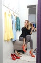 Young woman trying on shoes in dressing room Royalty Free Stock Photo