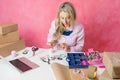 Woman turning her hobby into small business. Making jewellery at home and selling it online