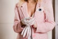 A young woman in a tweed jacket in white leather gloves Royalty Free Stock Photo