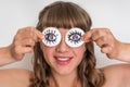 Young woman with two cotton pads to her eyes Royalty Free Stock Photo