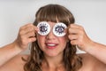 Young woman with two cotton pads to her eyes Royalty Free Stock Photo