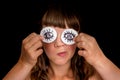 Young woman with two cotton pads to her eyes Royalty Free Stock Photo