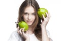 Young woman with two green apples Royalty Free Stock Photo