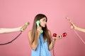 Young woman and two hands with handsets