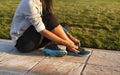 Young woman tying shoelace of sneakers to make outwork training running. Fitness and healthy lifestyle Royalty Free Stock Photo