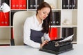 Young woman with typewriter. Royalty Free Stock Photo