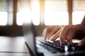 Young Woman Typing Computer Laptop Keyboard. Closeup shot and Selective focus on Finger. Working on Desk Royalty Free Stock Photo