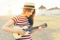 Young woman ukulele sunset Royalty Free Stock Photo