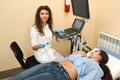 Young woman on the ultrasound, health check with the doctor