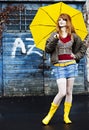 Young woman with umbrella on a rainy day