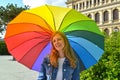 The young woman under an iridescent umbrella in summer day Royalty Free Stock Photo