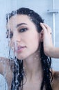 Young woman under shower with water drops Royalty Free Stock Photo