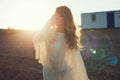 Young woman under sunset light, outdoors portrait. Royalty Free Stock Photo