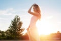 Young woman under sunset light, outdoors portrait. Royalty Free Stock Photo