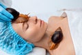 Young woman undergoing treatment with giant Achatina snails in beauty salon