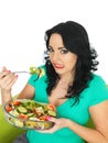 Young Woman Unhappy Expression Eating a Fresh Crisp Mixed Garden Salad Royalty Free Stock Photo