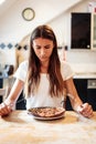 Young Woman Is Unhappy With Her Burnt Pizza For Lunch Royalty Free Stock Photo