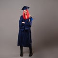 Young woman is a university graduate. Happy graduate master in a robe and cap.