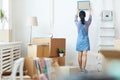 Young Woman Unpacking Boxes in New Home Royalty Free Stock Photo