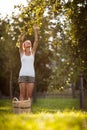 Young woman up on a ladder picking apples from an apple tree Royalty Free Stock Photo