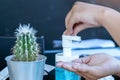 Young woman uses her hand to press hand sanitizer bottle to clean her hand. Hand sanitizer alcohol gel rub clean hands hygiene Royalty Free Stock Photo