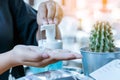 Young woman uses her hand to press hand sanitizer bottle to clean her hand. Hand sanitizer alcohol gel rub clean hands hygiene Royalty Free Stock Photo